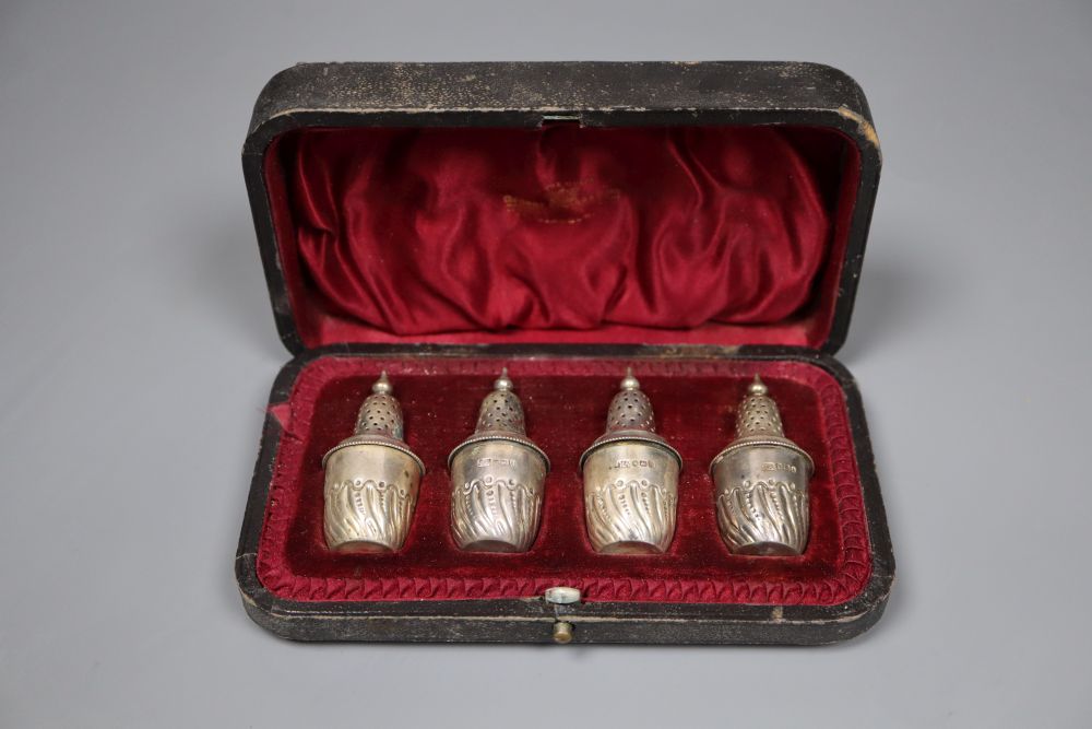 A cased set of four late Victorian silver pepper pots, Atkin Brothers, Sheffield 1897, 56mm.